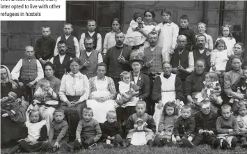  ??  ?? Community spirit
A group of refugees in Barnsley, 1914. Although Belgians at first moved in with British families, many later opted to live with other refugees in hostels