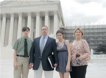  ??  ?? The Maines in front of the Supreme Court during a family trip to Washington.