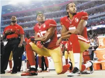  ?? Marcio Jose Sanchez / Associated Press 2016 ?? Safety Eric Reid and Colin Kaepernick kneel during the national anthem before the 49ers’ opening game last year.