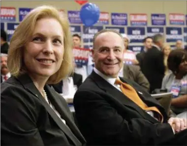  ?? AP FILE PHOTO ?? Sen. Kirsten Gillibrand, D-N.Y., left, is joined by Sen. Chuck Schumer, D-N.Y., during a breakfast reception at the New York State Democratic Committee State Convention, Wednesday, May 26, 2010, in Rye Brook, N.Y.