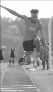  ??  ?? (Left) Ridgeland’s Gabe Ashley won the 1600 and the 3200 for Ridgeland at a meet in LaFayette last Tuesday. (Above) LaFayette’s LaTrail McClinc goes for maximum distance in the triple jump event. The Region 6-AAAA championsh­ips will be at Southeast...