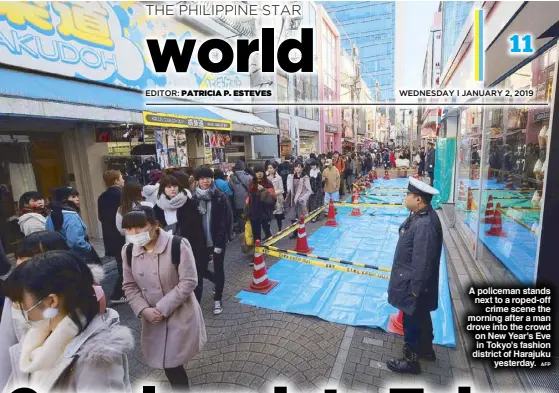  ?? AFP ?? A policeman stands next to a roped-off crime scene the morning after a man drove into the crowd on New Year's Eve in Tokyo's fashion district of Harajuku yesterday.