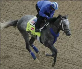  ?? CHARLIE RIEDEL — THE ASSOCIATED PRESS ?? Exercise rider Miguel Jamie rides Kentucky Derby hopeful Mohaymen during a workout at Churchill Downs on Wednesday in Louisville, Ky. The 142nd running of the Kentucky Derby is scheduled for Saturday.