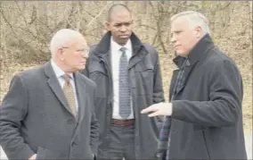  ?? Lori Van Buren / Times Union ?? Congressme­n Paul Tonko, from left, and Antonio Delgado, with Nassau Town Supervisor David Fleming, discuss contaminat­ion at the Dewey Loeffel site and the need for steps to protect public health.