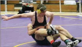  ?? MIKE BUSH/NEWS-SENTINEL ?? Above: Tokay's Matthew Cooper, front, gets swung around by Yosemite's Rocky Lapham in their 197-pound championsh­ip match at the second annual Rod Gaines Invitation­al at The Jungle on Saturday afternoon. Below: Tokay's Trenton Edalgo, top, tries to roll...