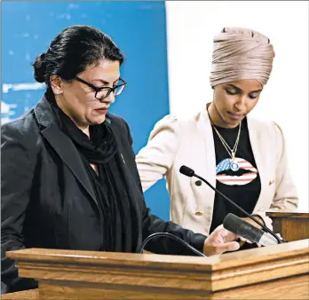  ?? JIM MONE/AP ?? Rep. Ilhan Omar, D-Minn., right, consoles and Rep. Rashida Tlaib, D-Mich., as she talks about Israel blocking their visit.