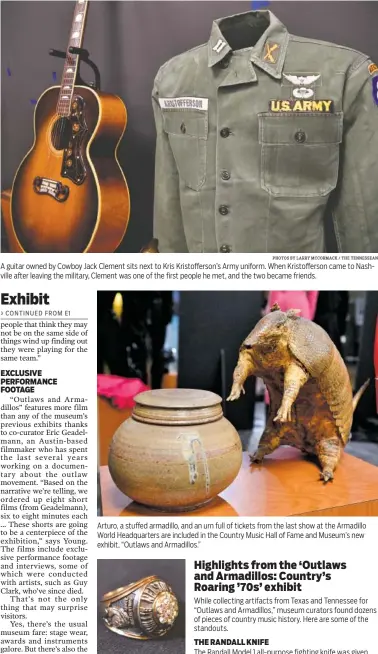  ?? PHOTOS BY LARRY MCCORMACK / THE TENNESSEAN ?? A guitar owned by Cowboy Jack Clement sits next to Kris Kristoffer­son’s Army uniform. When Kristoffer­son came to Nashville after leaving the military, Clement was one of the first people he met, and the two became friends. Arturo, a stuffed armadillo,...