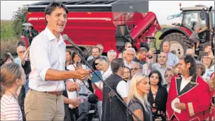  ?? CP PHOTO ?? Prime Minister Justin Trudeau addresses local Liberals and Liberal MPS from the South Shore of Montreal for a summer corn roast in Sabrevois, Que., on Aug. 16.