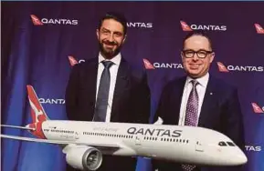  ??  ?? Qantas Airways group chief executive officer Alan Joyce (right) and chief financial officer Tino La Spina at the airline’s full-year result announceme­nt in Sydney yesterday.
