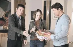  ?? HOPPER STONE/SMPSP ?? Jason Bateman and Rachel McAdams get competitiv­e with Kyle Chandler in “Game Night.”