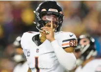  ?? ALEX BRANDON/AP ?? Bears quarterbac­k Justin Fields gestures after throwing a touchdown pass against the Commanders on Oct. 5 in Landover, Md.