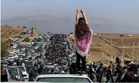  ?? Amini. Photograph: UGC/AFP/Getty ?? An image posted on Twitter reportedly showing protesters heading towards a cemetery in Saqez, western Iran, in October after the death of Mahsa