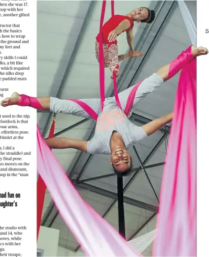  ??  ?? Roxanne Andrew in red and Gigi Abels perform aerial acrobatics at the Silk Workshop in Montague Gardens, Cape Town.