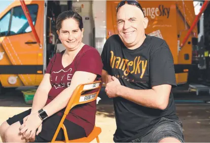  ?? STRONG SUPPORT: Salvation Army Volunteer Zoeanne Elliott with service manager of Orange Sky Townsville Jason Southwell outside the hybrid laundry and shower van. Picture: ALIX SWEENEY ??