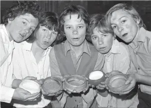  ??  ?? Oliver (Carl Sutherland, centre) joined Harry Halliday, Roy Edinburgh, Andrew Wooldridge and David Maguire ahead of their appearance on stage in 1975. Ref:133202-7