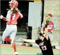  ?? PHOTO BY RICK PECK ?? McDonald County first baseman Aubree Dunn stretches out for a throw to retire a Webb City runner during the Lady Mustangs 4-1 win in the semifinals of the district softball tournament on Oct. 6 at Joplin High School.