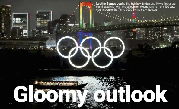  ??  ?? Let the Games begin: The Rainbow Bridge and Tokyo Tower are illuminate­d with Olympic colours on Wednesday to mark 100 days countdown to the Tokyo 2020 Olympics. — Reuters