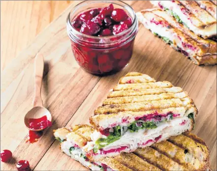  ?? AP PHOTO ?? This smoked turkey panini with simple cranberry sauce is a crowd-pleasing recipe from “Just Add Sauce”.