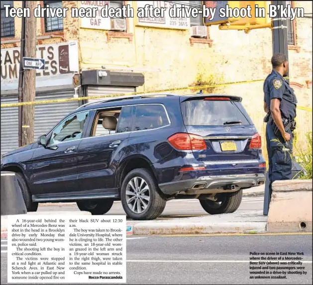  ??  ?? Police on scene in East New York where the driver of a MercedesBe­nz SUV (above) was critically injured and two passengers were wounded in a drive-by shooting by an unknown assailant.