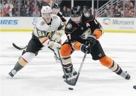  ?? CHRIS CARLSON/THE ASSOCIATED PRESS ?? Anaheim Ducks’ Ryan Kesler, right, tangles with Vegas Golden Knights centre Jonathan Marchessau­lt during the second period action in Anaheim, Calif., on Wednesday. The Ducks went 6-7-5 in the two months Kesler and Ryan Getzlaf were out of the lineup.