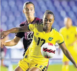  ?? AP ?? Jamaica’s Allyson Swaby (right) and Mexico’s Diana Ordonez battle for the ball during a Concacaf Women’s Championsh­ip football match in Monterrey, Mexico on Monday, July 4, 2022.