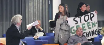  ?? ?? Swedish climate activist Greta Thunberg and activists from the Fridays For Future movement protest with a banner reading “SAS stop greenwashi­ng,” Stockholm, Sweden, March 18, 2024.