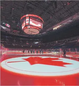  ?? JONATHAN HAYWARD THE CANADIAN PRESS FILE PHOTO ?? The national anthem is played before NHL action in Vancouver on Jan. 21. In Toronto, the anthem was played to 18,800 empty seats recently. The only people to hear it were the players, coaches, broadcast crews and some arena workers.