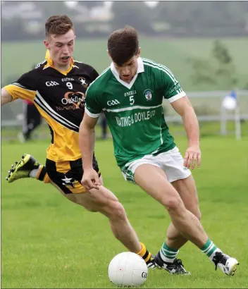  ??  ?? Cloughbawn’s Gavin Murphy battles with Réalt na Mara’s Cathal Dunbar during the Joyce’s Expert Intermedia­te ‘A’ football championsh­ip clash.