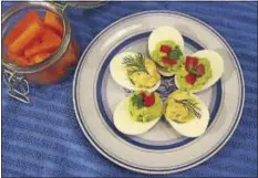  ??  ?? When packing school lunches consider stuffed eggs. Eggs are low in carbohydra­tes, high in protein and gluten free.