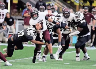  ?? / Jeremy Stewart ?? Heard County quarterbac­k Alijah Huzzie (5) is hit by Rockmart’s Daquan Banks in the backfield during the third quarter of Wednesday’s championsh­ip game.