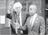  ?? SETH WENIG/ASSOCIATED PRESS ?? Democratic presidenti­al candidate Bernie Sanders waves to media and suppor ters af ter meeting with Al Sharpton in New York Cit y. Sanders hopes to increa se his suppor t among African-Americans.