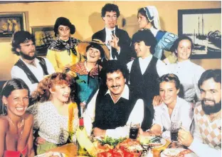  ?? CONTRIBUTE­D ?? Claudette Getson, back right, as the Cranky Cook is shown with the Governor's Feast cast. Dished out on the table is a seafood and lobster dinner, part of the experience.