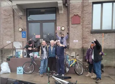  ?? PHOTO PROVIDED ?? Michael Cecchini, founder of Cheech Outreach, delivers donations to a group of people on Woodlawn Avenue in downtown Saratoga Springs.