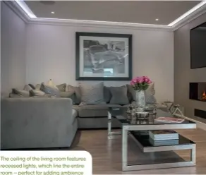  ??  ?? The ceiling of the living room features recessed lights, which line the entire room – perfect for adding ambience