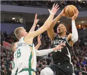  ?? Stacy Revere/getty Images ?? Giannis Antetokoun­mpo (34) scored 24 points to lead the Bucks to a 135-102 win vs. the Celtics.