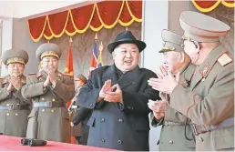  ?? KCNA VIA KNS/AFP/GETTY IMAGES ?? North Korean leader Kim Jong Un observes a parade marking the 70th anniversar­y of the Korean People’s Army.