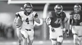  ??  ?? Houston’s Lincoln Pare (4) rushes against Colliervil­le.