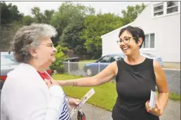  ?? Brian A. Pounds / Hearst Connecticu­t Media ?? Republican candidate for state Senate District 14 Pam Staneski, right, greets voter Marie Busk while campaignin­g door to door in Milford on Monday.