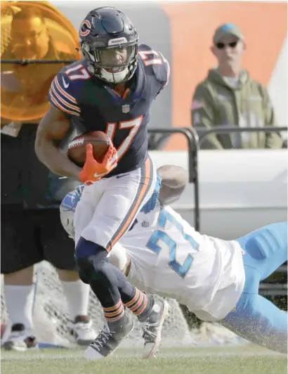  ?? NAM Y. HUH/AP ?? Receiver Anthony Miller breaks free from Lions safety Glover Quin en route to a 45-yard touchdown in the second quarter.