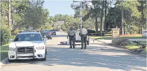  ??  ?? SCENE OF THE CRIME: Police patrol the area of a fatal shooting in Florence, South Carolina on Thursday.