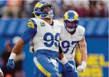  ?? Mark J. Terrill/Associated Press ?? Defensive tackle Aaron Donald (99) is one of only three players to win defensive player of the year honors three times.