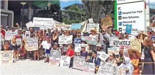  ?? - Reuters ?? SOLIDARITY: Asylum-seeker advocates gather outside Brisbane’s Lady Cilento Children’s Hospital in support of one-year-old baby Asha in Brisbane, on Sunday.