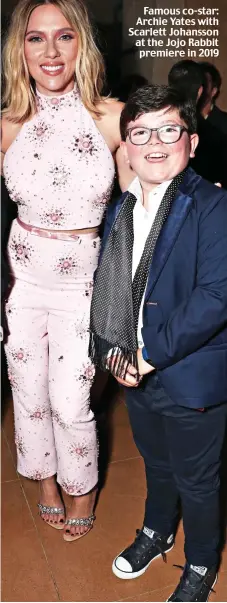  ?? ?? Famous co-star: Archie Yates with Scarlett Johansson at the Jojo Rabbit premiere in 2019