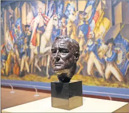  ?? [DOUG HOKE/ THE OKLAHOMAN] ?? Jo Davidson's bronze bust of Franklin D. Roosevelt is displayed in front of Gardner Hale's oil-on-canvas mural “Triumph of Washington” in the Oklahoma City Museum of Art exhibit “Renewing the American Spirit: The Art of the Great Depression.”