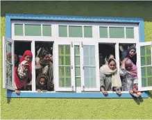  ?? Reuters ?? Kashmiris watch the funeral procession of Nasir Ahmad, a suspected separatist militant, on Wednesday