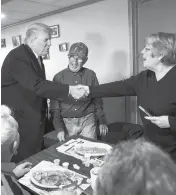  ?? DAVID GOLDMAN/ASSOCIATED PRESS ?? Donald Trump shakes hands with Elaine Chiechon while visiting the Chez Vacon restaurant in Manchester, N.H., on Feb. 7, 2016.