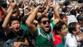  ??  ?? Mexican fans’ faces bursting with joy as their team beat Germany.