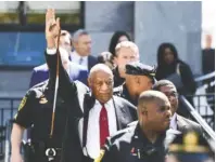  ?? AP PHOTO BY COREY PERRINE ?? Bill Cosby gestures as he leaves his sexual assault trial Thursday at the Montgomery County Courthouse in Norristown, Pa.
