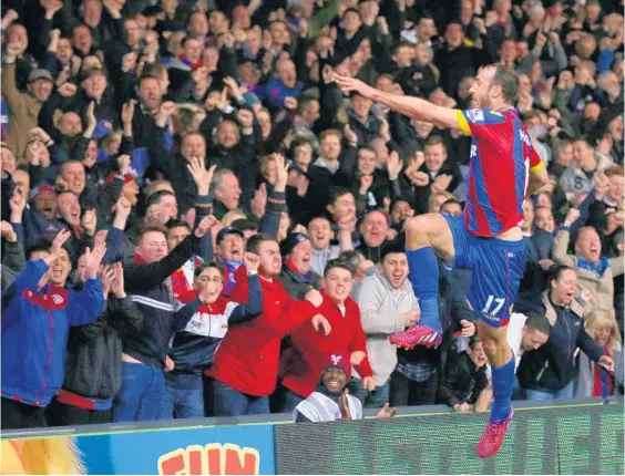  ?? Picture / AP ?? Crystal Palace fans celebrate with Glenn Murray after his first-half strike against Manchester City yesterday.