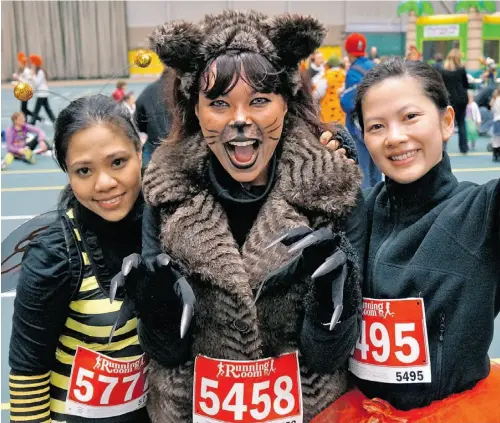  ?? Photos: Caroline Gault/ Edmonton Journal ?? From left, Daisy Pigao, Layna Johnson and Cecilia Nguyen represent the Royal Alexandra Hospital at the Halloween Howl Fun Run/ Walk for the Alberta Diabetes Foundation.